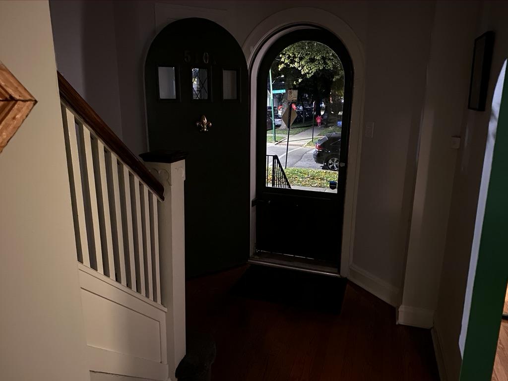 Image of an open door taken from inside a home. 